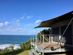 a view from the balcony of a house overlooking the ocean at Lorne Foreshore Caravan Park in Lorne