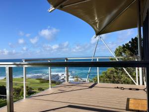 a view from a balcony overlooking the ocean at Lorne Foreshore Caravan Park in Lorne