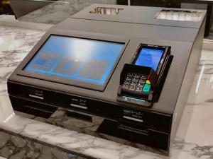 an electronic device with a cell phone on a counter at APA Hotel & Resort Yokohama Bay Tower in Yokohama