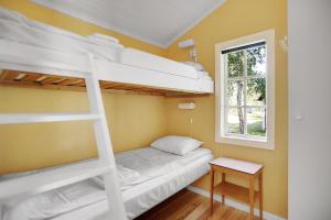 Postel nebo postele na pokoji v ubytování Ljugarns Semesterby + 37 fotografií