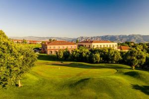 an aerial view of a golf course with a green at Il Picciolo Etna Golf Resort & Spa in Castiglione di Sicilia