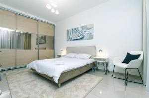 Säng eller sängar i ett rum på Baseina Apartments