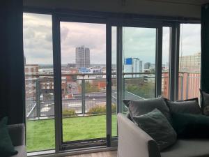 a living room with a view of a city at Paramount Views in Swindon