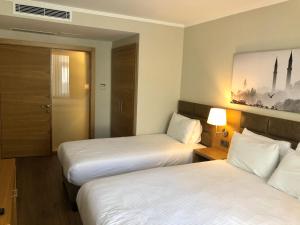 Postel nebo postele na pokoji v ubytování Hotel Fehmi Bey - Special Category