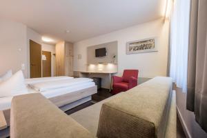 Postel nebo postele na pokoji v ubytování Landhotel Traube