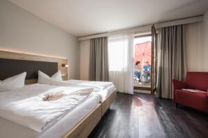 Postel nebo postele na pokoji v ubytování Landhotel Traube