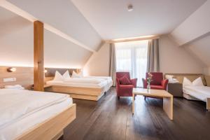 Postel nebo postele na pokoji v ubytování Landhotel Traube