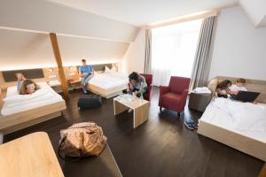 Postel nebo postele na pokoji v ubytování Landhotel Traube
