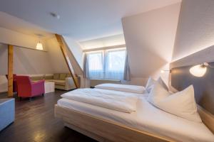 Postel nebo postele na pokoji v ubytování Landhotel Traube