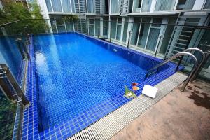 a swimming pool with a toy in the middle of a building at Glenwood Residences in Ho Chi Minh City