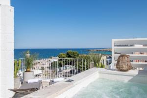 a swimming pool with a view of the ocean at Palazzo Mulini in Monopoli