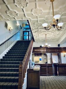 a staircase in a building with a stair case at The Clarendon Hotel in Morecambe