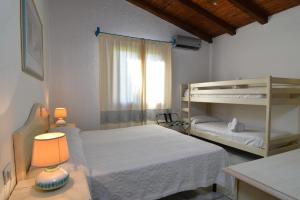 Postel nebo postele na pokoji v ubytování Li Suari Club Village + 37 fotografií
