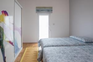 Posteľ alebo postele v izbe v ubytovaní Bella Vista 2