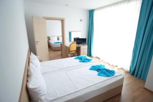 Postel nebo postele na pokoji v ubytování Hotel Elitza