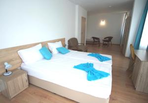 Postel nebo postele na pokoji v ubytování Hotel Elitza