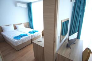 Postel nebo postele na pokoji v ubytování Hotel Elitza