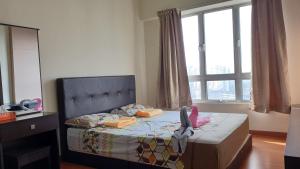 a bedroom with a bed with a headboard and a window at Sweet Sweet Zenith Johor Bahru in Johor Bahru +25 photos