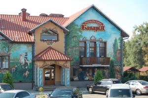a building with a mural on the side of it at Готель Баварія in Poltava