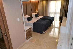 Postel nebo postele na pokoji v ubytování Extenso Hotel