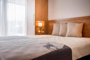 Posteľ alebo postele v izbe v ubytovaní Chalet Dorf Wagrain Alpenleben by AlpenTravel