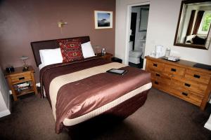 Voodi või voodid majutusasutuse Glyn Peris Guest House toas