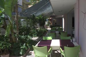 A restaurant or other place to eat at Rosella Hotel