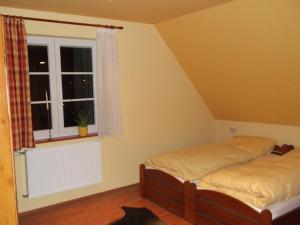 Ένα ή περισσότερα κρεβάτια σε δωμάτιο στο Gasthaus Vogelgarten