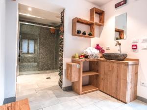 a bathroom with a sink and a shower at Residence Lake Como in Colico