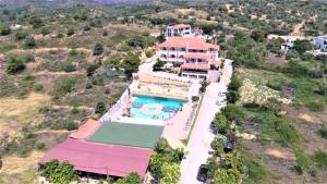 an aerial view of a house with a swimming pool at Thassos Hotel Grand Beach in Limenaria