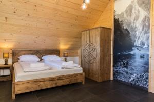 Postel nebo postele na pokoji v ubytování udanypobyt Apartamenty Czorsztyn Panorama