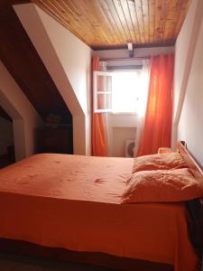 Cama o camas de una habitación en Location saisonnière Les Agapanthes
