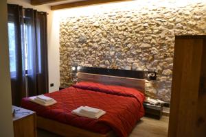 A bed or beds in a room at Agriturismo Tamellini