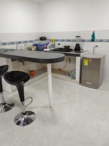 A kitchen or kitchenette at Emvacamo'