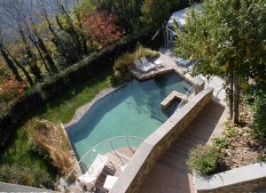 an overhead view of a swimming pool with lounge chairs at Eden Rock Resort in Florence