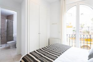 Postel nebo postele na pokoji v ubytování Genteel Home Mateos Gago