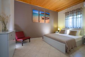 Voodi või voodid majutusasutuse Ionian View Villas toas