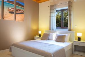 Voodi või voodid majutusasutuse Ionian View Villas toas