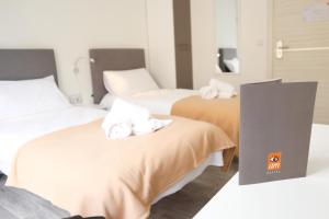 Una cama o camas en una habitación de AM Hostel