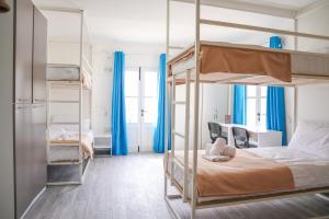 Una cama o camas en una habitación de AM Hostel