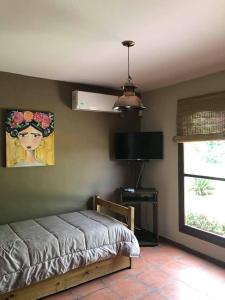 Ένα ή περισσότερα κρεβάτια σε δωμάτιο στο Cabañas La Cosecha +102 φωτογραφίες