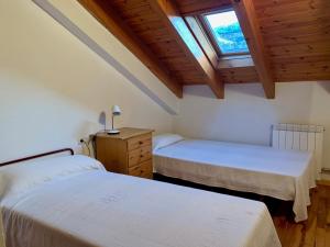 A bed or beds in a room at BPIRINEOS-Estós