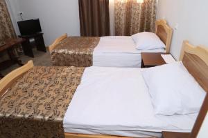 Ένα ή περισσότερα κρεβάτια σε δωμάτιο στο Cottages in Vanadzor