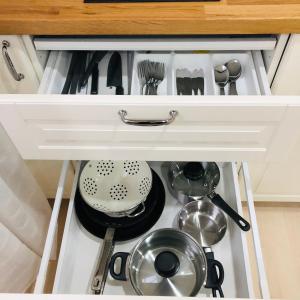 a drawer in a kitchen with utensils at Main-Apartments in Wertheim