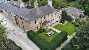 an aerial view of a large brick house at Wayside , 3 bed , 2 bath charming house close to Lincoln in Lincoln