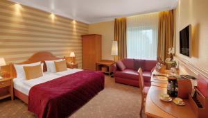 Postel nebo postele na pokoji v ubytování Hotel Wegner - T h e culinary art hotel