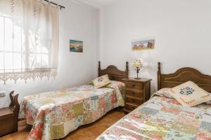 Giường trong phòng chung tại La casa del estanque +18 ảnh