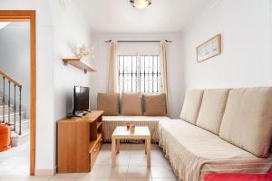 Telewizja i/lub zestaw kina domowego w obiekcie Apartamento Doña Alba