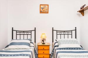 Postel nebo postele na pokoji v ubytování Familia Amaya Gonzalez