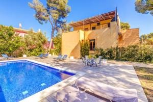 a backyard with a swimming pool and a house at Green Bike in Santa Ponsa